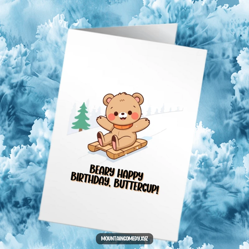 Funny Free Printable Birthday Card: Happy bear cub joyfully slides down a snowy mountain on a sled, spreading birthday cheer.